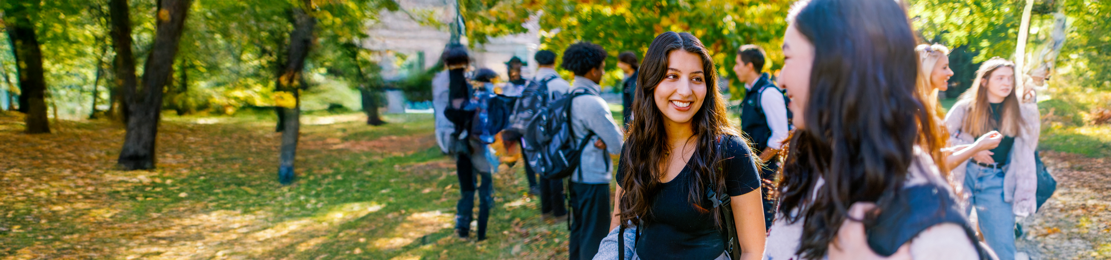 Students outdoors talking on campus